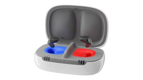 Rechargeable hearing aids in a grey, blue, and red charger.