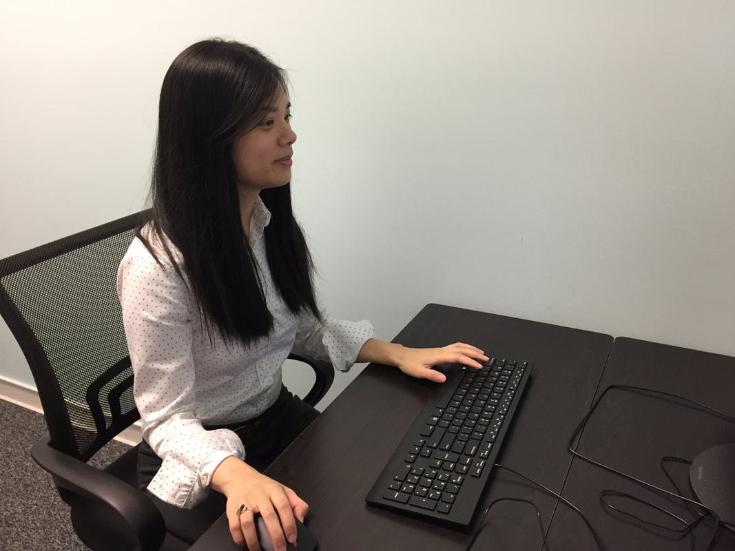 woman at desk researching mild hearing loss at lititz pa hearing aid office