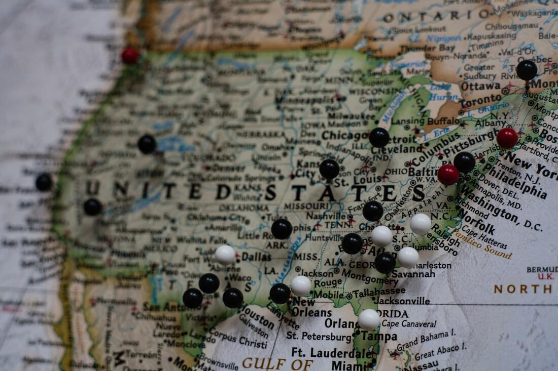 map of the united states with ball push pins indicating different cities with hearing history-related facts