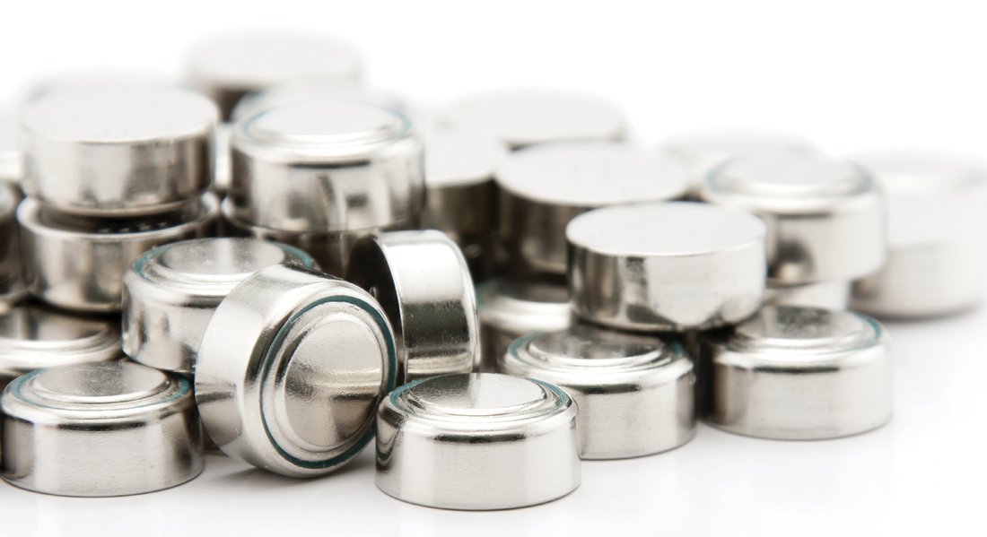 a pile of silver disposable button batteries for hearing aids available in lancaster pa