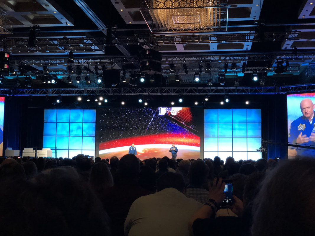 astronaut mark kelly on stage at starkey hearing aid convention