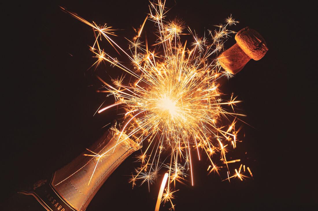 loud cork popping off a bottle of champagne while fireworks go off in lancaster county