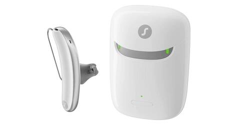 A behind-the-ear hearing aid with a white and grey charger is available in Lancaster, PA.