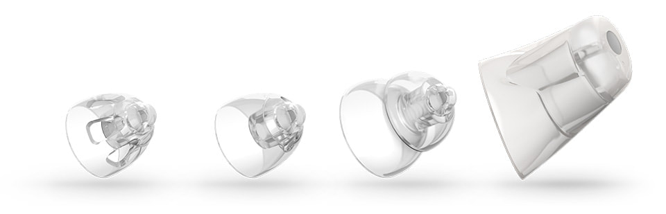 clear hearing aid domes in four different sizes
