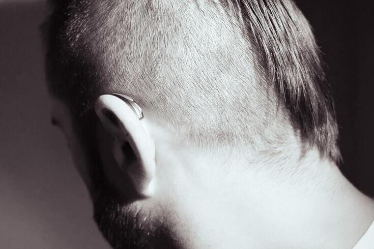 lancaster county man with partial buzz cut and beard wears behind the ear hearing aid on left ear