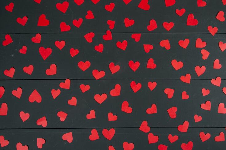 red-valentine-hearts-against-black-backdrop