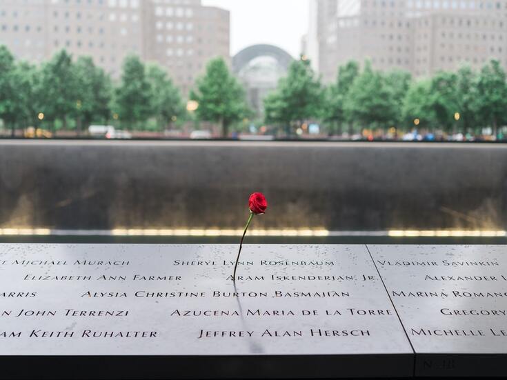 rose-placed-on-9-11-memorial-in-nyc-with-trees-in-background