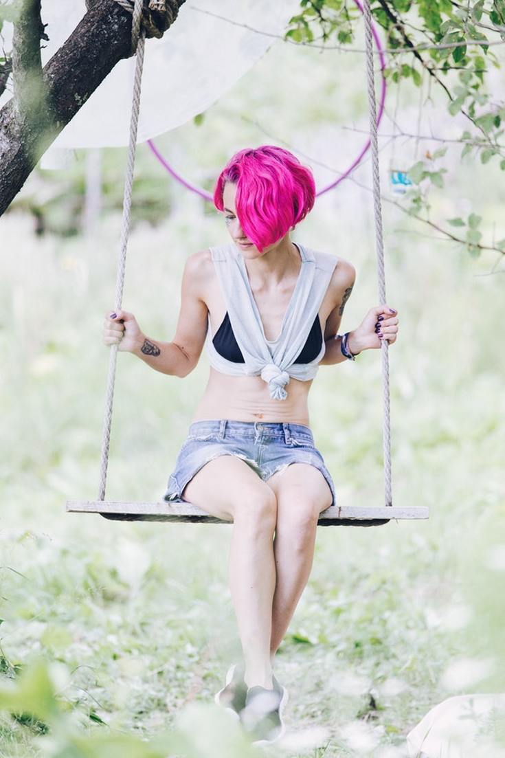 woman_on_swing_experiencing_anorexia_and_hearing_loss