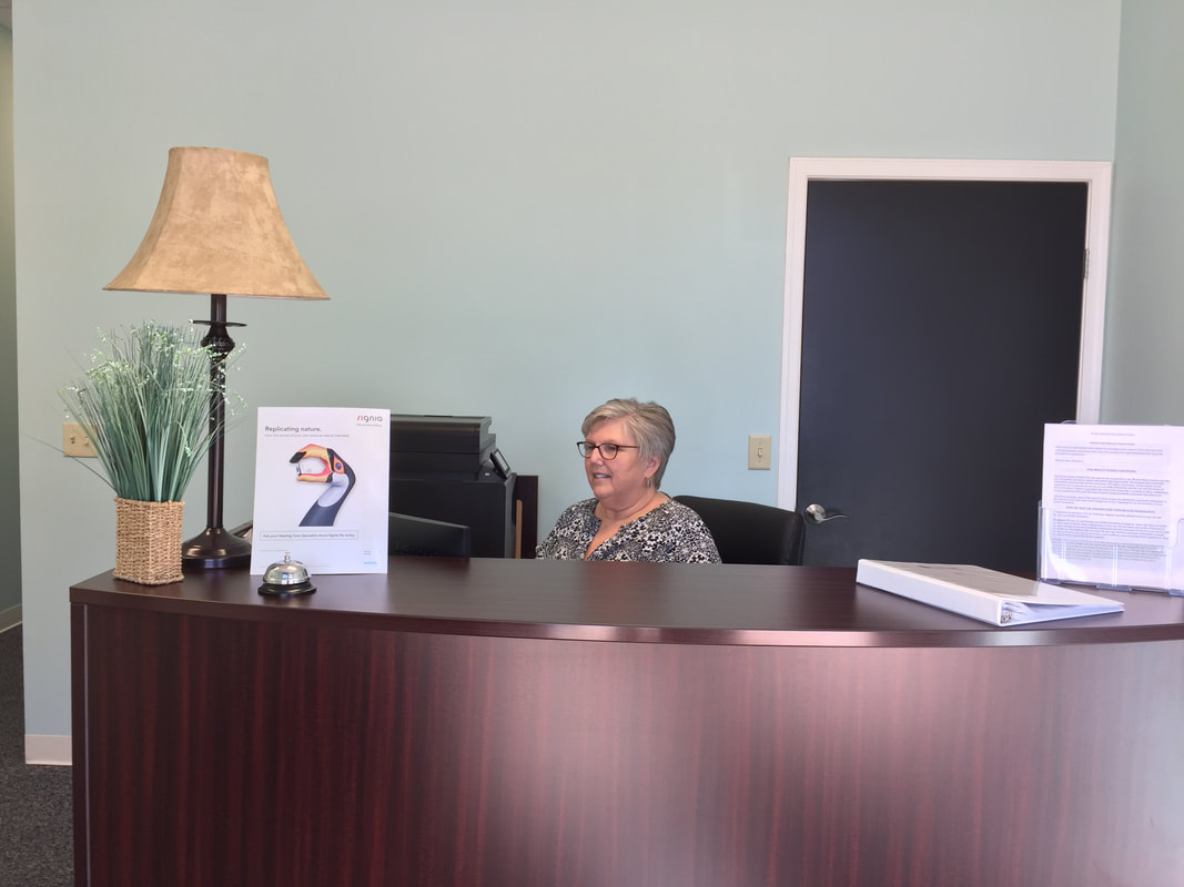 receptionist at front desk in lancaster county hearing aid office