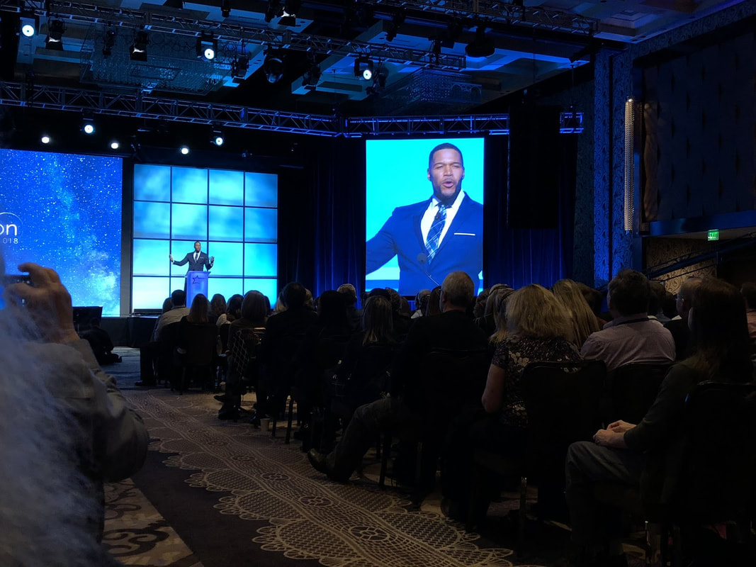 tv host and former football player michael strahan at hearing aid convention
