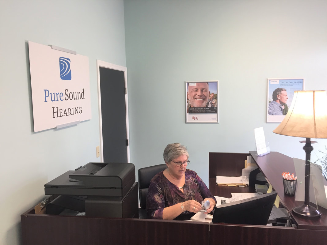 woman organizes hearing aid delivery for hearing aid devices in lititz office